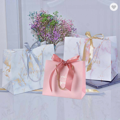 Harga yang bagus CMYK Ribon Pernikahan Kecil Genggam Tas Hadiah Terima Kasih Tas Kertas 300gsm daring